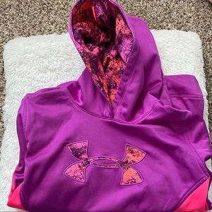 A purple and pink Under Armour hoodie